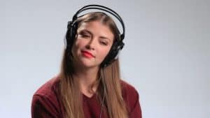 Girl listening to subliminals with headphones